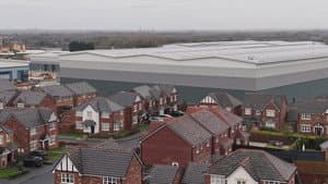 Giant warehouses built at the end of our gardens